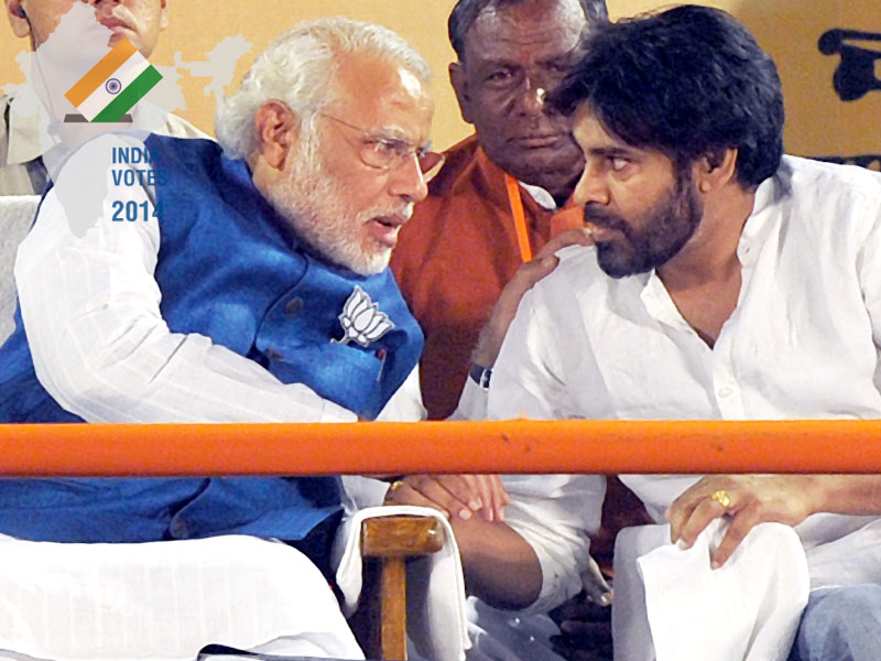 narendra modi greets jana sena party chief and actor pawan kalayan at an national democratic alliance election rally for the bjp and allied parties in hyderabad photo afp