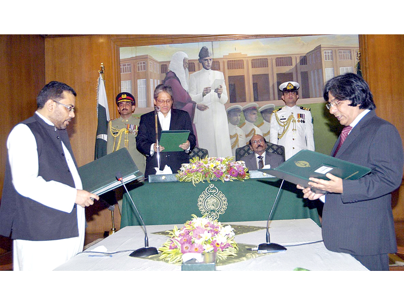 sindh governor dr ishratul ebad khan administers oath to two newly inducted ministers of mqm photo app