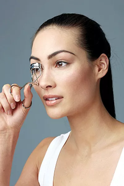 start by curling the top lashes begin at the root of the lashes and be careful not to get any skin into the eyelash curler