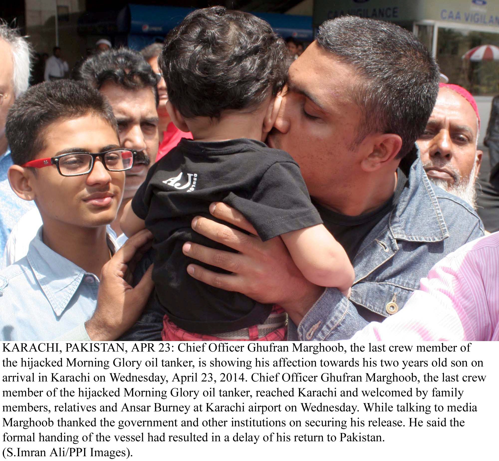 chief officer of morning glory ghufran marghoob of kisses his son after returning to karachi on wednesday photo ppi