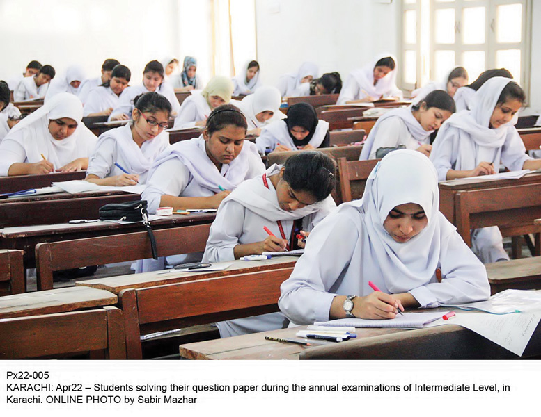 students busy solving question papers during their intermediate examination in karachi on wednesday photo online