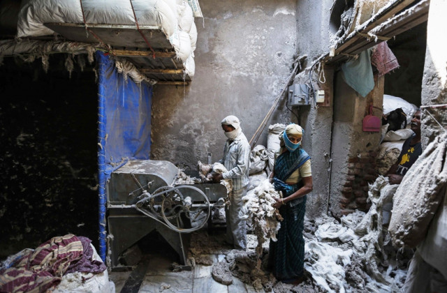 employees work inside a cotton recycling factory in a slum in mumbai march 3 2014 photo reuters