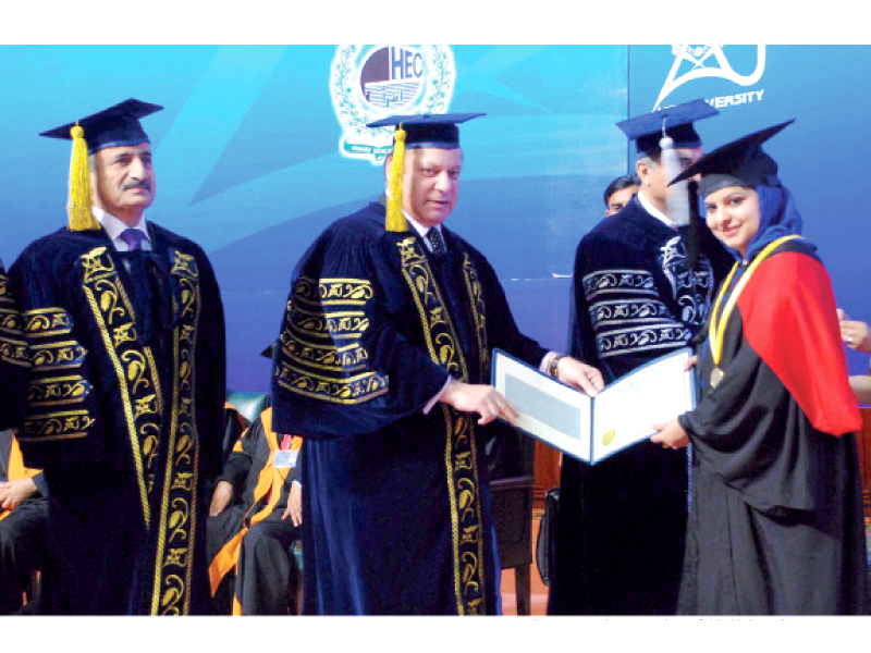 prime minister awarding a degree to a student at the air university convocation photo inp