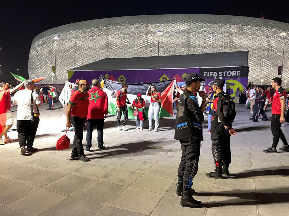 soccer football   fifa world cup qatar 2022   group f   canada v morocco   al thumama stadium doha qatar   december 1 2022 general view as fans hold a palestine flag outside the stadium reuters charlotte bruneau