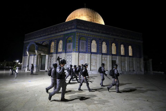 israeli police walk near the dome of the rock during clashes with palestinians at a compound known to muslims as noble sanctuary and to jews as temple mount amid tension over the possible eviction of several palestinian families from homes on land claimed by jewish settlers in the sheikh jarrah neighbourhood in jerusalem s old city may 7 2021 photo reuters file israeli police walk near the dome of the rock during clashes with palestinians at a compound known to muslims as noble sanctuary and to jews as temple mount amid tension over the possible eviction of several palestinian families from homes on land claimed by jewish settlers in the sheikh jarrah neighbourhood in jerusalem s old city may 7 2021 photo reuters file
