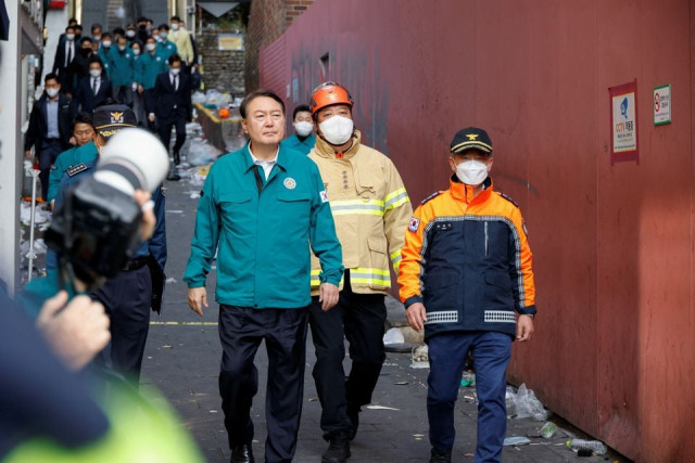 south korean president yoon suk yeol walks at the scene where many people died and were injured in a stampede during a halloween festival in seoul south korea october 30 2022 reuters heo ran south korean president yoon suk yeol walks at the scene where many people died and were injured in a stampede during a halloween festival in seoul south korea october 30 2022 reuters heo ran