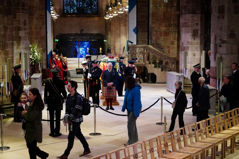 king charles iii and other members of the royal family hold a vigil at st giles cathedral edinburgh in honour of queen elizabeth ii as members of the public walk past photo reuters