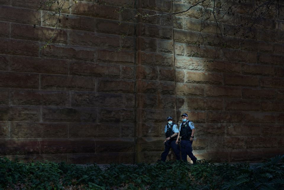 masked police officers patrol the quiet city centre during a lockdown to curb a coronavirus disease covid 19 outbreak in sydney australia august 20 2021 photo reuters