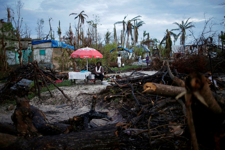 A food vendor waits for customers after Hurricane Matthew hit Jeremie, Haiti. PHOTO: REUTERS
