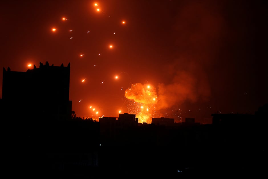 A Houthi arms depot explodes after it was hit by air strikes in Sanaa, Yemen. PHOTO: REUTERS