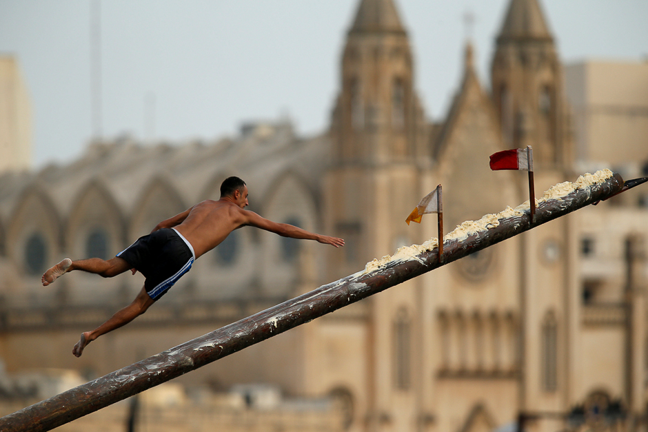 A competitor tries to grab a flag on the 