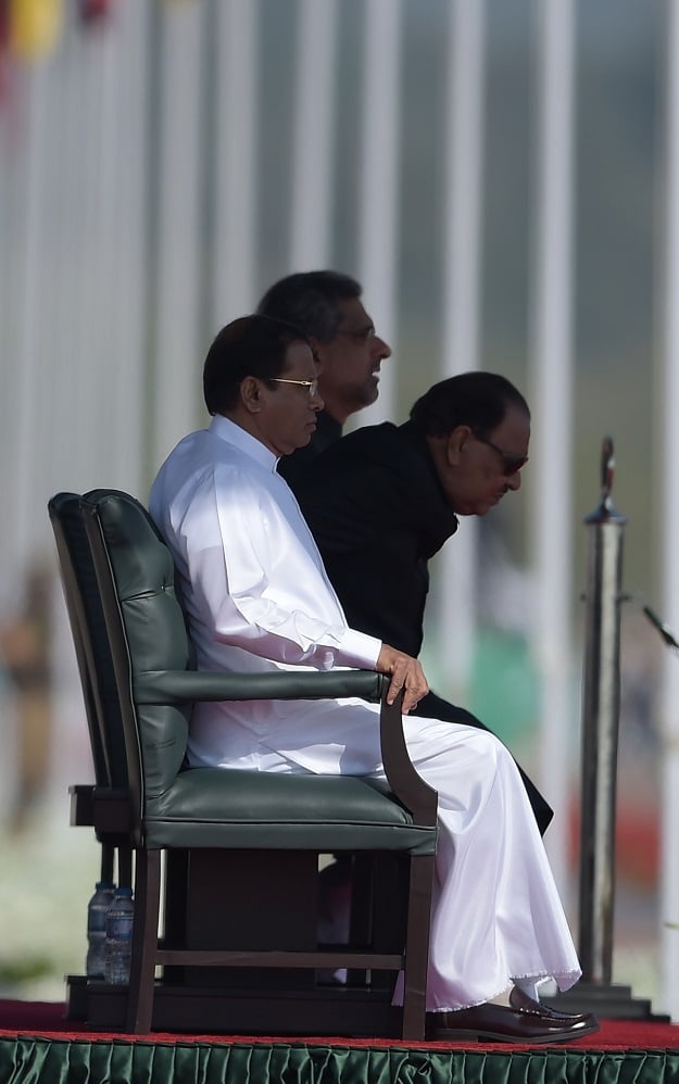 Pakistan's President Mamnoon Hussain (R), Sri Lankan President Maithripala Sirisena (L) and Pakistani Prime Minister Shahid Khaqan Abbasi attend the Pakistan Day military parade in Islamabad on March 23, 2018. PHOTO: AFP