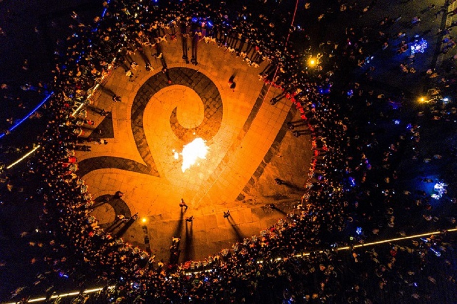 This aerial photo shows people gathering around a bonfire as they celebrate the torch festival in Bijie, China's southwestern Guizhou province. PHOTO: AFP