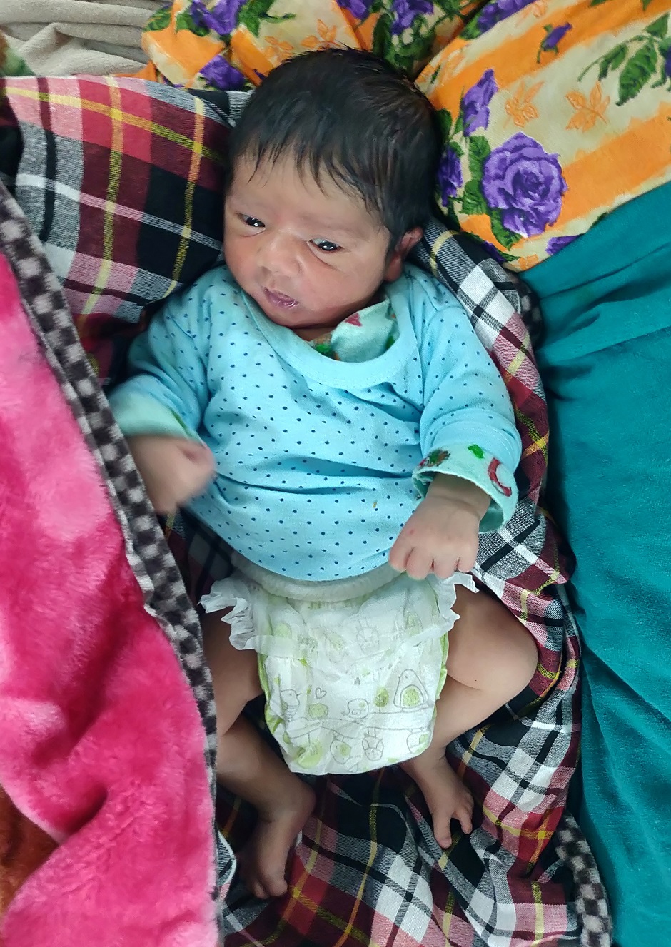 A baby boy is pictured in a hospital two days after his birth for which his parents travelled hours from south Kashmir's Kokernag to reach a Srinagar hospital, Kashmir. Photo: REUTERS