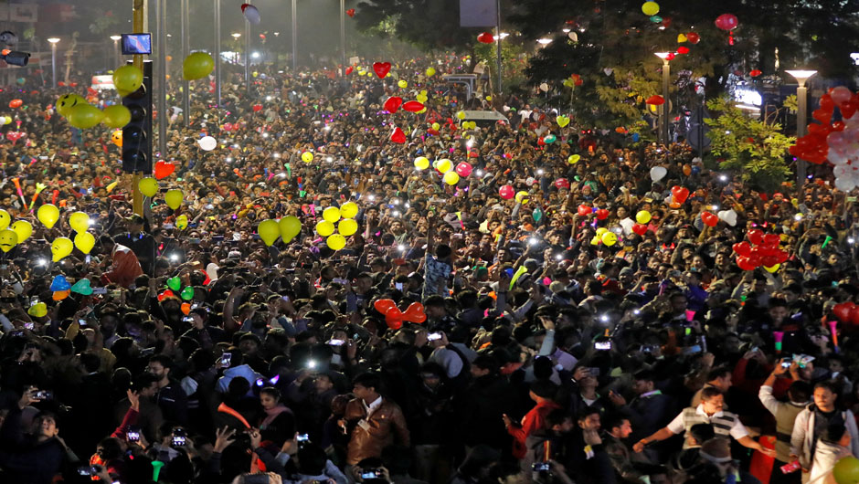 People release balloons as they celebrate the New Year's countdown event in a road in Ahmedabad, India, January 1, 2020. PHOTO: REUTERS