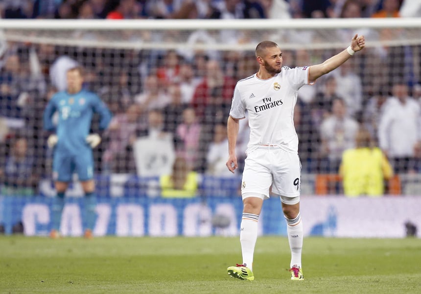 real struck early through benzema and comfortably held bayern at bay to beat the holders 1 0 and move a step closer to a first champions league final in 12 years photo reuters