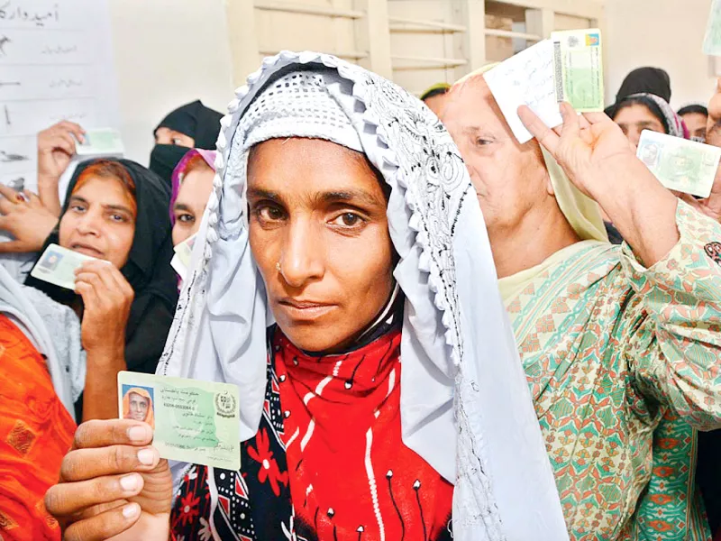 women wait for their turn at a polling station in larkana during by elections photo app women wait for their turn at a polling station in larkana during by elections photo app