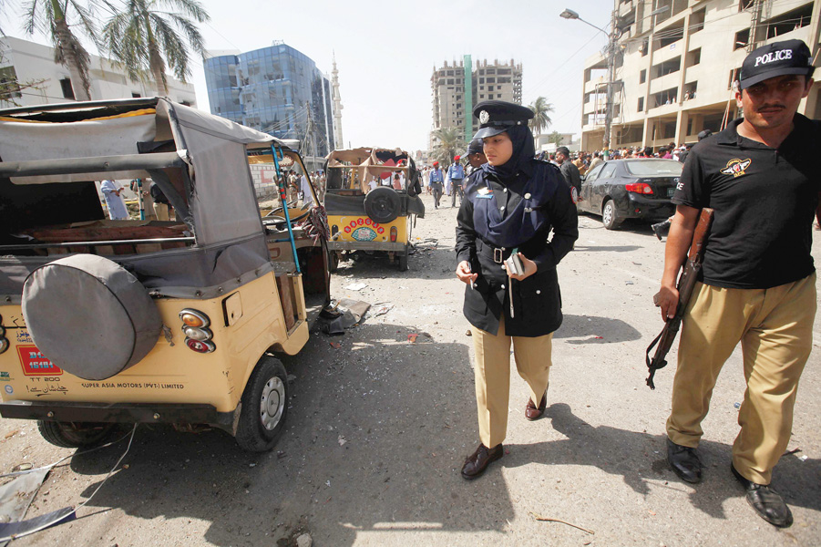 frere asp shahla qureshi surveys the site of the explosion near gizri that killed four people clifton sho syeda ghazala also brought her team to help out photo reuters