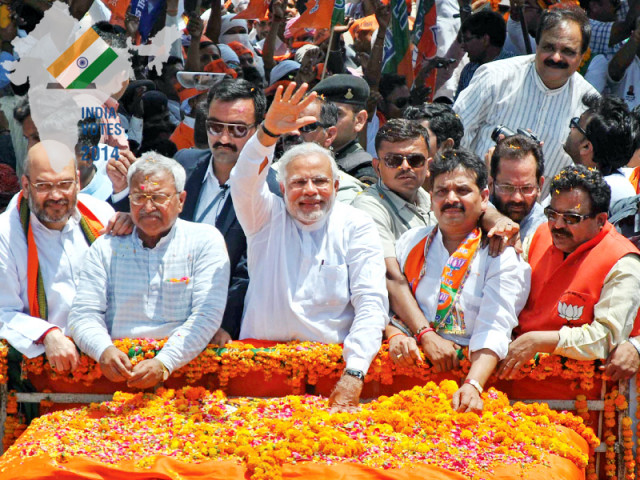 bjp prime ministerial candidate and chief minister of gujarat narendra modi waves to his supporters photo afp file bjp prime ministerial candidate and chief minister of gujarat narendra modi waves to his supporters photo afp file