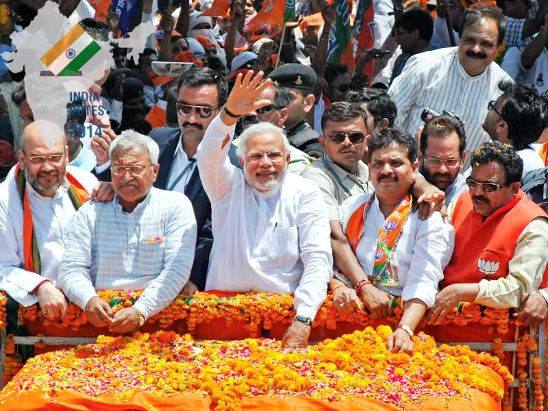 bjp prime ministerial candidate and chief minister of gujarat narendra modi waves to his supporters photo afp file