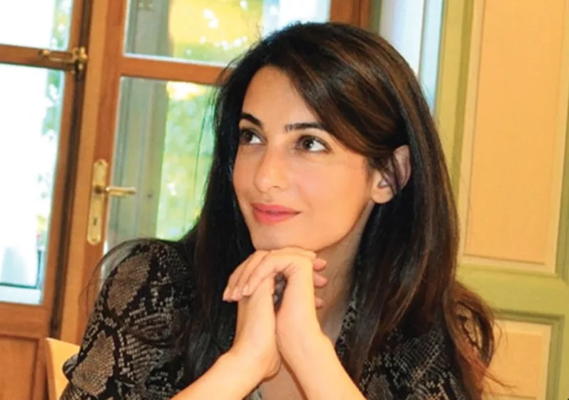 alamuddin 36 was spotted last week wearing a large ring on that finger at a los angeles restaurant where she and clooney 52 were apparently celebrating their engagement with friends alamuddin 36 was spotted last week wearing a large ring on that finger at a los angeles restaurant where she and clooney 52 were apparently celebrating their engagement with friends