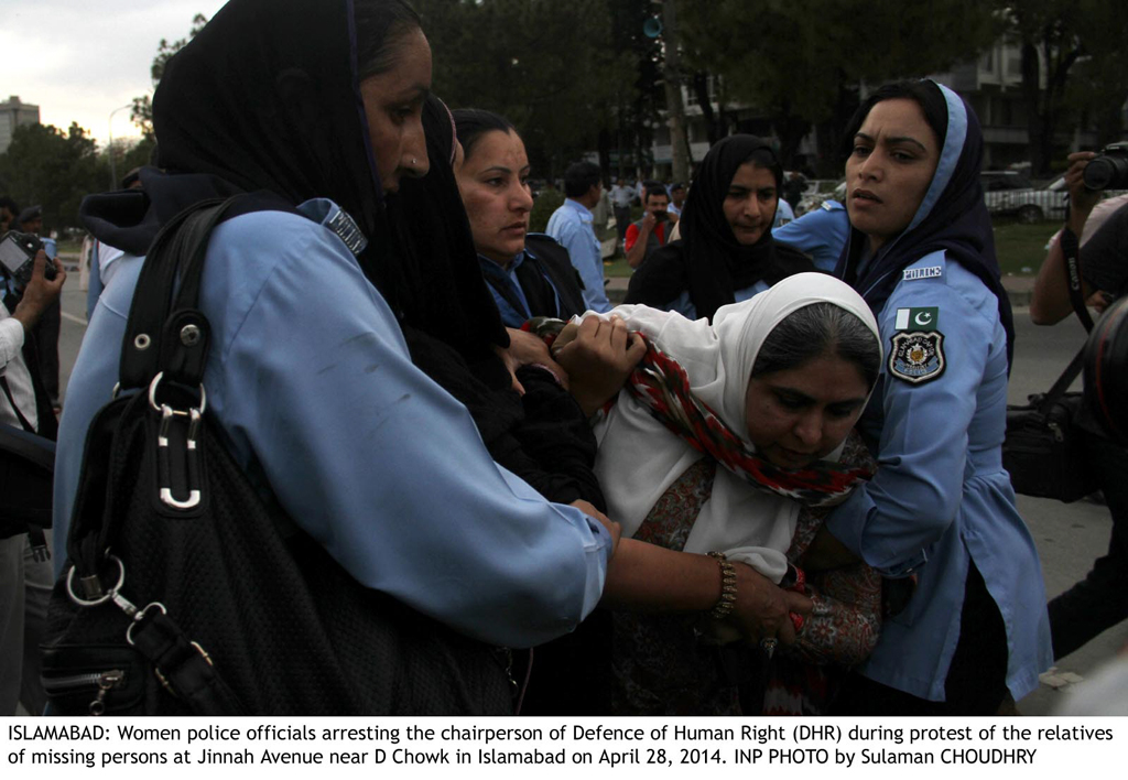 women police officers arresting amna janjua during the protest of the relatives of the missing persons at jinnah avenue near d chowk in islambad on april 28 2014 photo inp