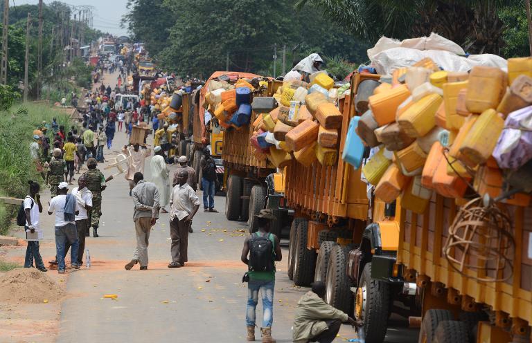 a convoy of vehicles loaded with people and goods carrying muslims from the pk12 district outside of bangui is seen before leaving the city on april 27 2014 photo afp