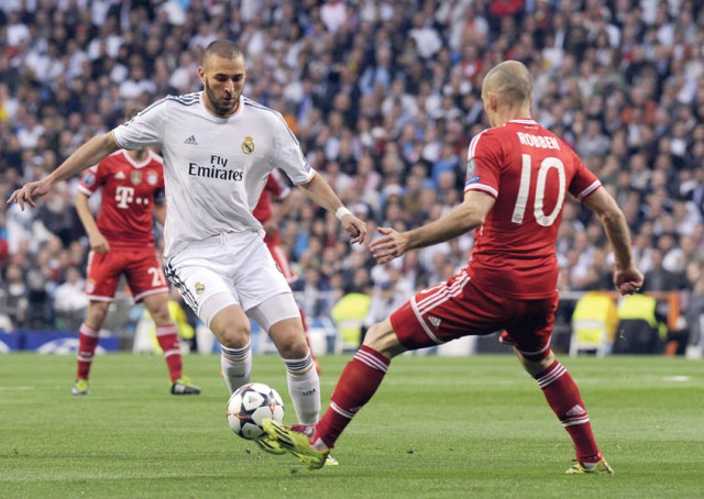 real madrid and bayern munich will be looking to dominate each other as the different styles of combat clash at the german giant s home ground photo afp