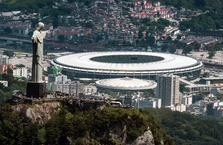 an aerial view of the christ the redeemer statue atop corcovado hill and the mario filho maracana stadium in rio de janeiro brazil on december 3 2013 photo afp an aerial view of the christ the redeemer statue atop corcovado hill and the mario filho maracana stadium in rio de janeiro brazil on december 3 2013 photo afp