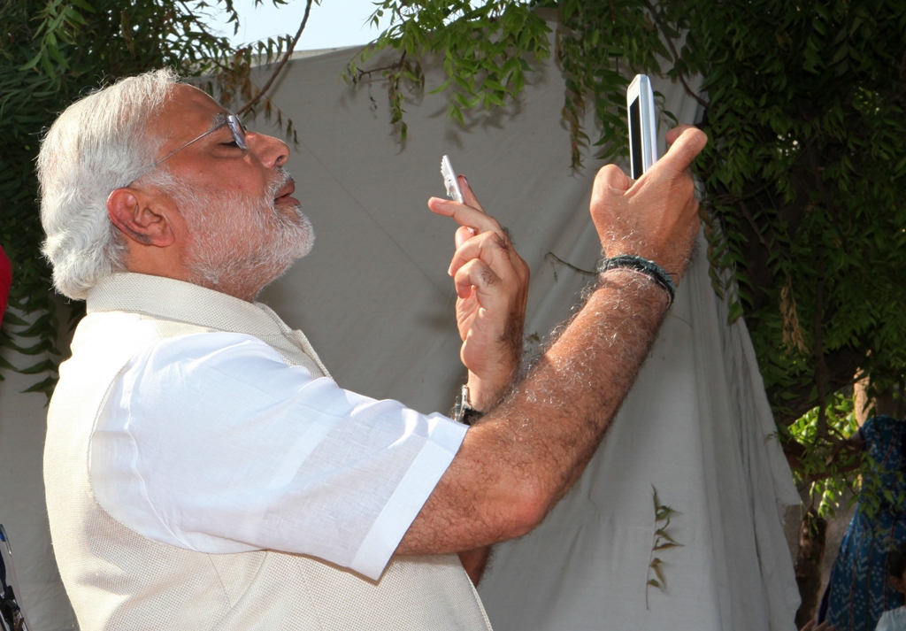 frontrunner for prime minister narendra modi takes a 039 selfie 039 after casting his vote at a polling station in ahmedabad on april 30 2014 photo afp