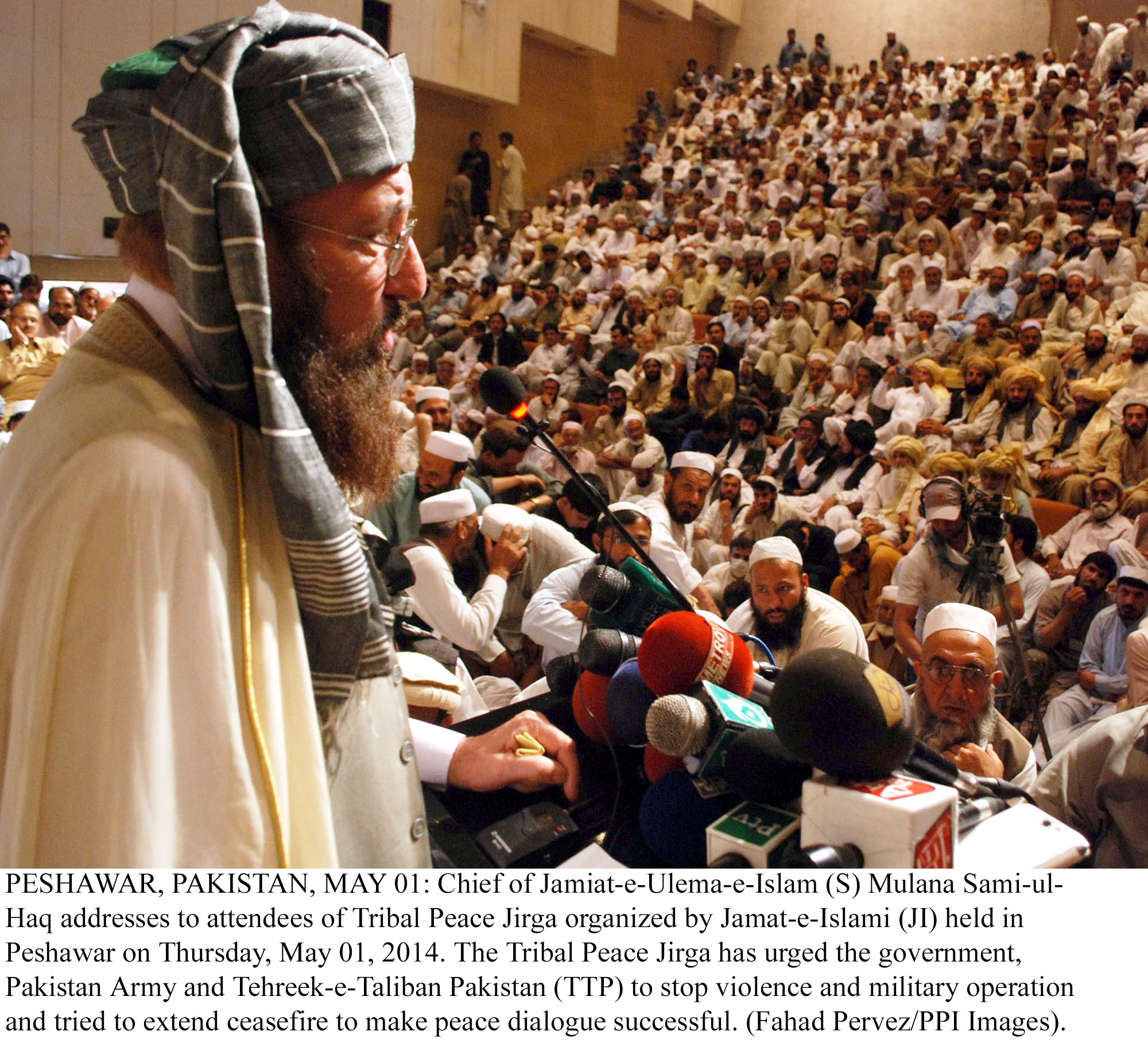 jui s chief maulana samiul haq addresses the attendees of tribal peace jirga organised by the jamat e islami ji in peshawar on may 1 2014