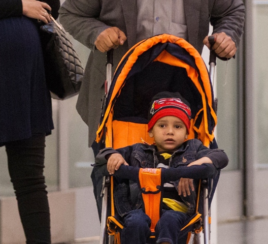 abuzar ahmad arrives at pearson airport in toronto ontario on april 30 2014 to start his life anew photo afp