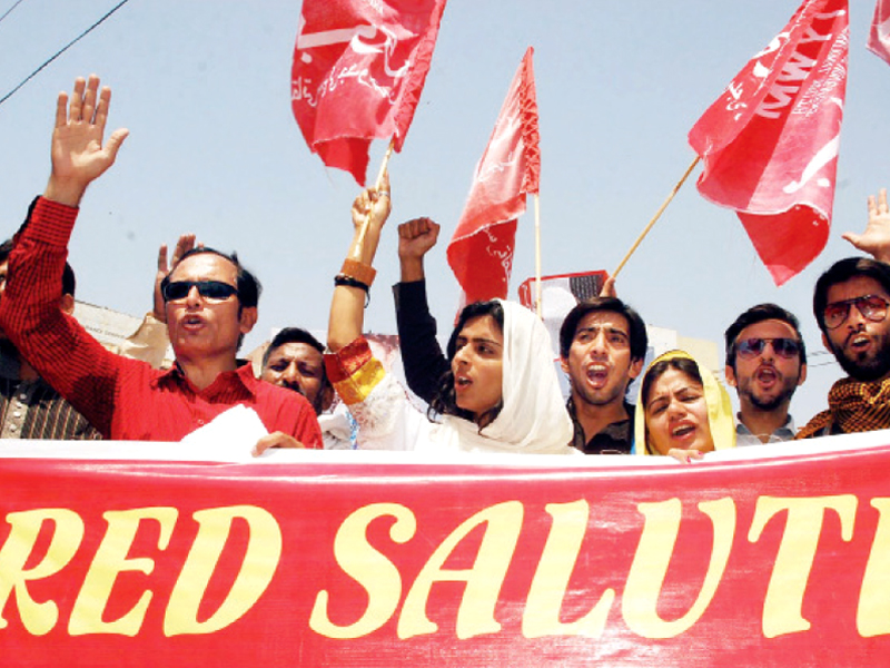 activists and unionists hold banners and chant slogans to mark international labour day photo abid nawaz express inp