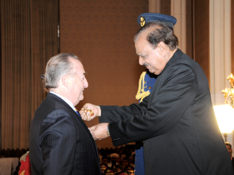 saravia receiving hilal e pakistan medal from mamnoon hussain on march 23 photo file