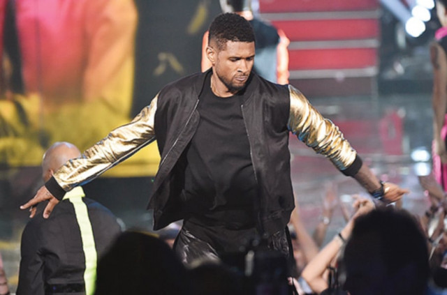 usher performs on the stage of the 2014 iheartradio music awards held at the shrine auditorium in los angeles photos file usher performs on the stage of the 2014 iheartradio music awards held at the shrine auditorium in los angeles photos file