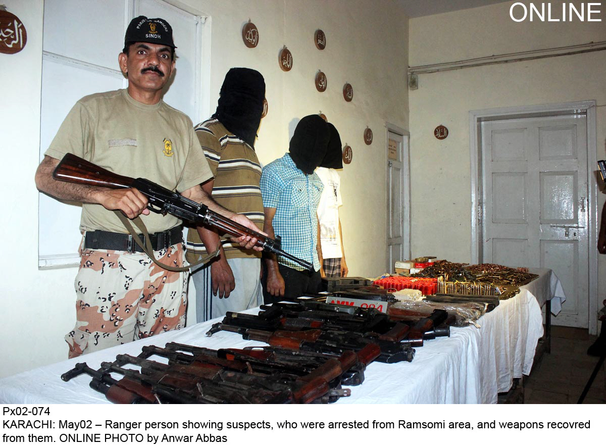 a ranger displays weapons that they recovered along with the suspects apprehended in security operations photo online