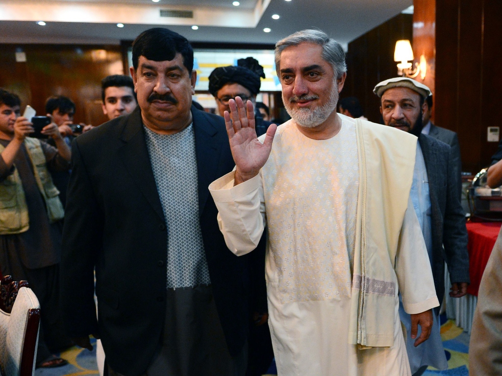 afghan presidential candidate abdullah abdullah r gestures as he arrives for a joint press conference with presidential candidate gul agha shirzai l in kabul photo afp