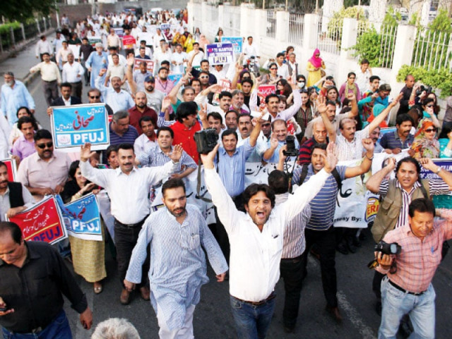 journalists hold placards and chant slogans on the mall photo abid nawaz express journalists hold placards and chant slogans on the mall photo abid nawaz express