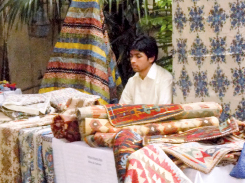 a man selling his crafts at the event photo express