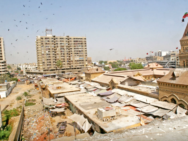 the under construction shahabuddin parking plaza can be seen on the left only a few hundred feet away from the empress market photo athar khan express