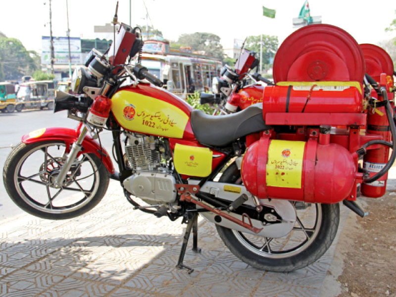 saylani welfare trust s motorcycle fire brigade can reach narrow streets and calm down fire emergencies until the larger fire trucks arrive photo ayesha mir express