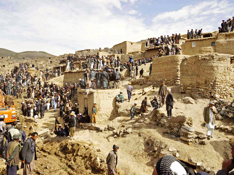 rescuers search for survivors trapped under the mud in argo district of badakhshan photo afp