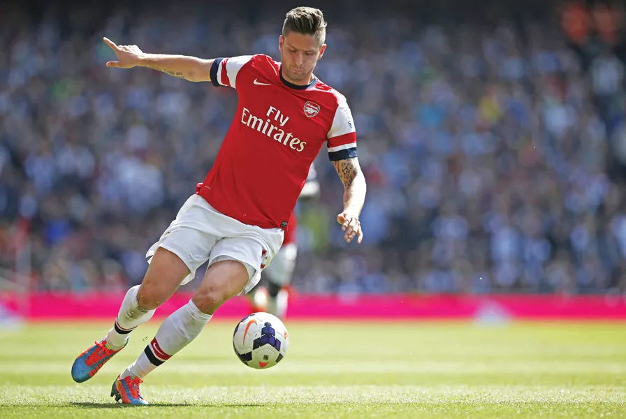 giroud headed home from a 14th minute corner to secure the points for arsenal who play at norwich city in their final league match next sunday photo afp giroud headed home from a 14th minute corner to secure the points for arsenal who play at norwich city in their final league match next sunday photo afp