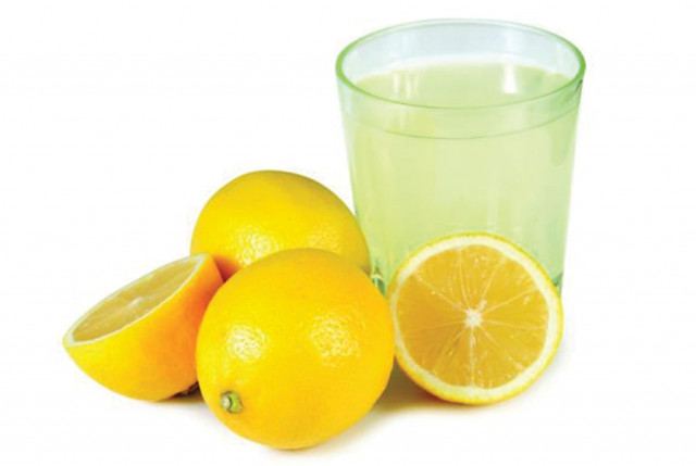 massaging your scalp with lemon juice helps in limiting flakes of dandruff photo file massaging your scalp with lemon juice helps in limiting flakes of dandruff photo file