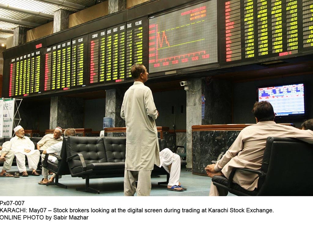 stock brokers looking at the digital during the trading session at kse on may 7 2014 photo online