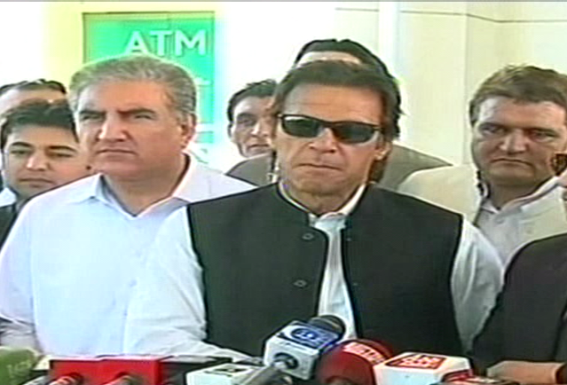 an express news screengrab of imran khan and shah mehmood qureshi during a press conference