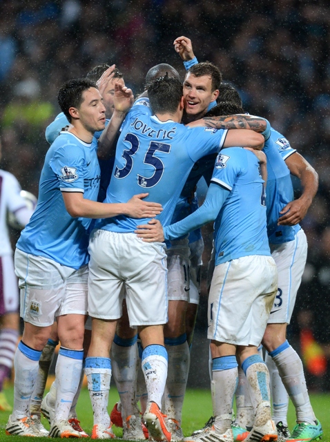 near the finish line villa resisted until the 64th minute but a quick fire dzeko brace put the hosts ahead and late goals from jovetic and toure took city 039 s goal tally to 100 in the league photo afp