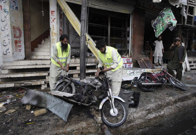 rescue workers remove a motorcycle from the site of a bomb blast in quetta may 8 2014 photo reuters rescue workers remove a motorcycle from the site of a bomb blast in quetta may 8 2014 photo reuters
