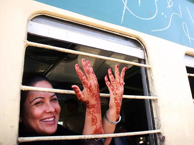 a woman showing mehndi on her hands as she sits on first eid special train leaving for peshawar from karachi 039 s cantt railway station in pakistan photo online a woman showing mehndi on her hands as she sits on first eid special train leaving for peshawar from karachi 039 s cantt railway station in pakistan photo online