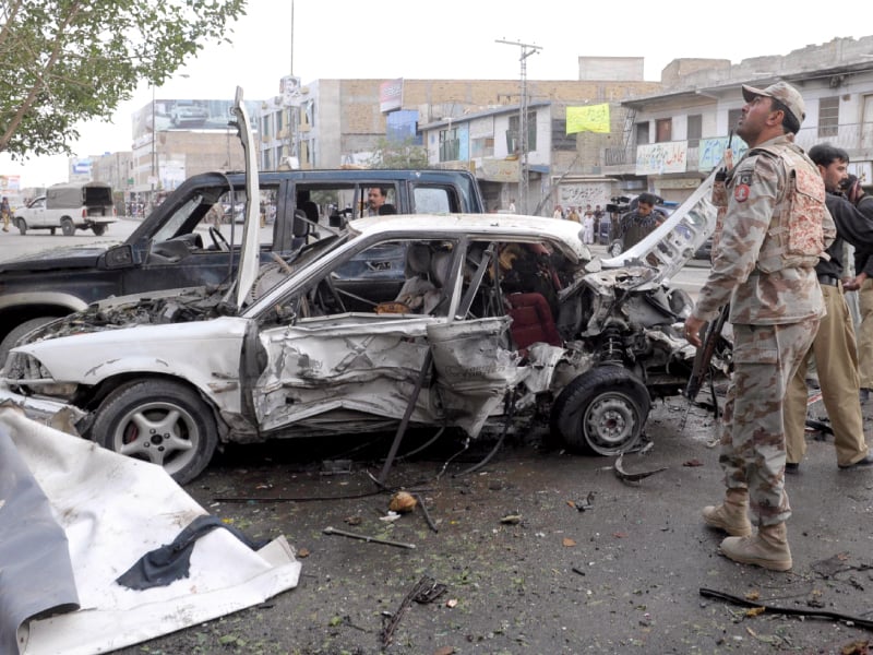 security officials inspect the site of a bomb explosion in quetta on thursday photo afp